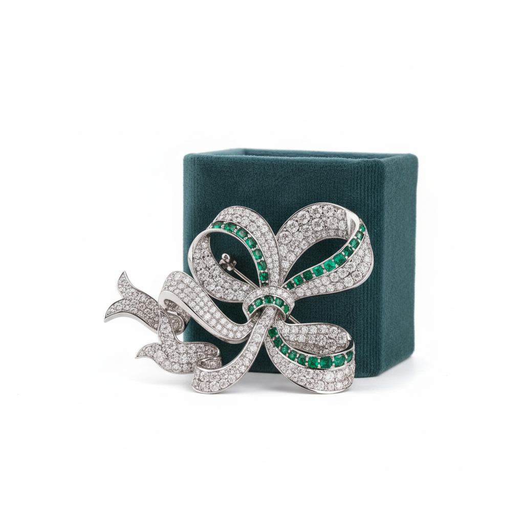 The Vanderbilt Brooche with packaging on white background